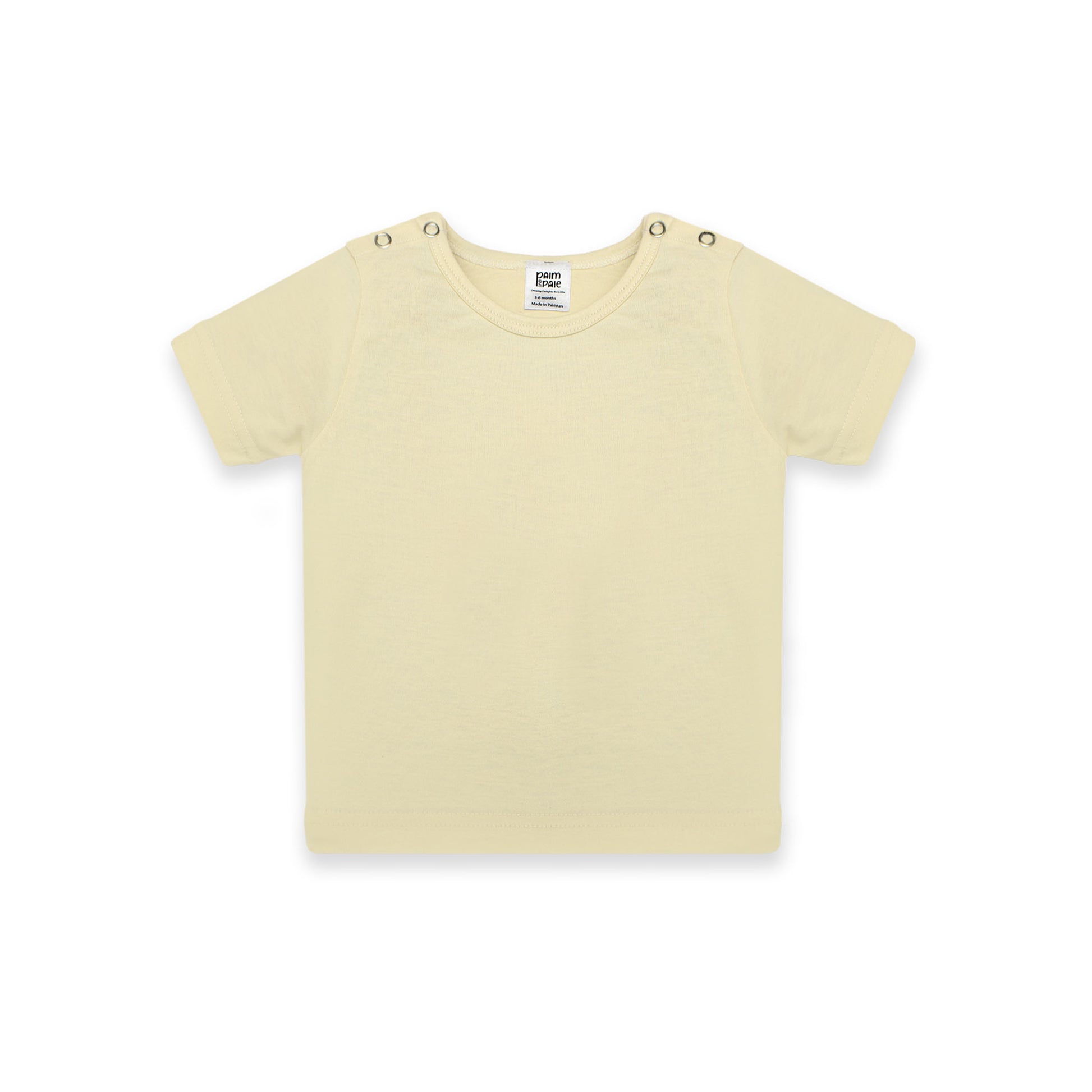 Newborn baby outfit featuring a soft pastel yellow T-shirt with snap buttons on the shoulders. The design highlights comfort and breathability, perfect for warm days. The background includes playful doodles,' and branding from Palm and Pale, emphasizing 'Sunny styles for little smiles.'